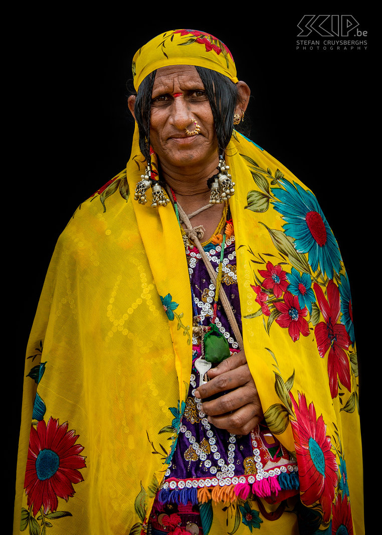 Banjara woman The Banjara or Lambani are nomadic people from the Indian state of Rajasthan who are now spread out all over Indian subcontinent. They are the largest gypsy group in India. In the past they were nomadic and traded and transported salt, grains, firewood and cattle. Nowadays most of them have settled down. The women make intricately embroidered colourful clothes with pieces of mirror, decorative beads and old coins.  They also wear ornate jewellery and some of them have tattoos. Banjaras speak Gor Boli, a language that originates from Sanskrit. Nowadays they also speak the predominant language of their surroundings. I photographed some Banjara women on different locations in the state of Karnataka in southern India. Stefan Cruysberghs